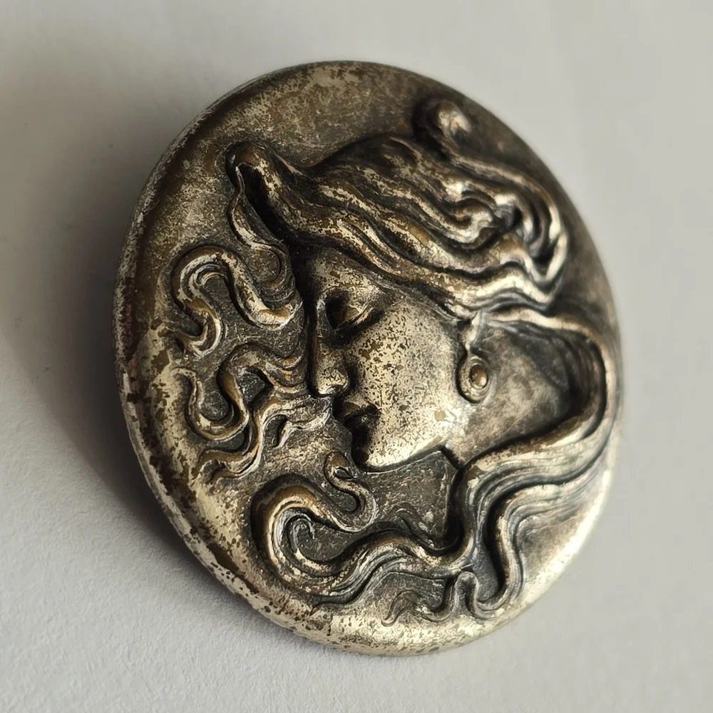 Art Nouveau style brooch woman with flowing hair dark silver tone pin